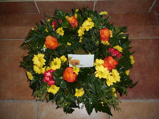 round orange and yellow sympathy wreath